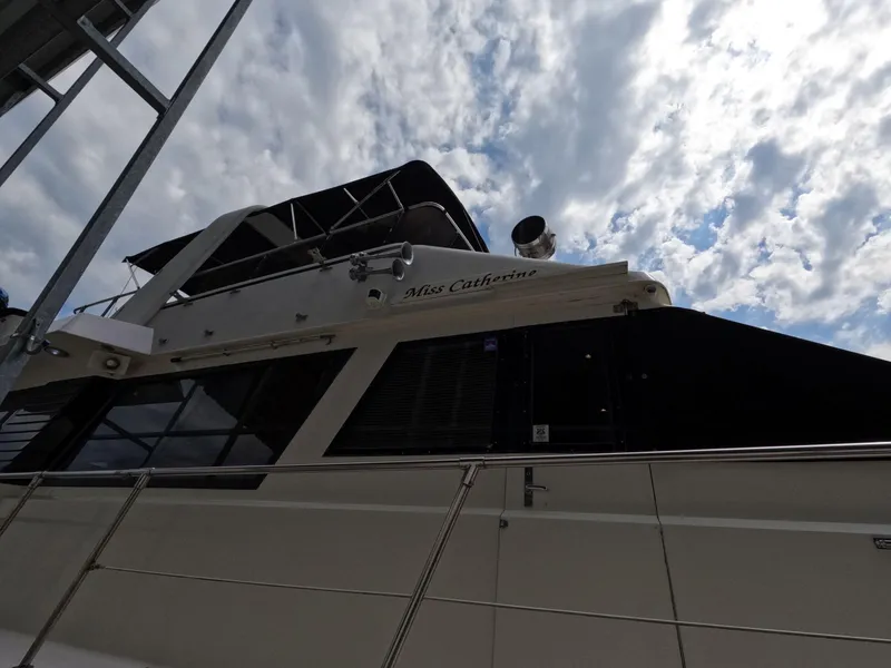 Slide: The Image of 1988 Viking Gulfstar 55 MY yacht under cloudy sky, side view. - 14