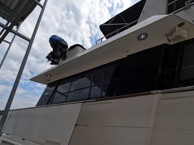 Slide: The Image of 1988 Viking Gulfstar 55 MY yacht docked under cloudy sky. - 18