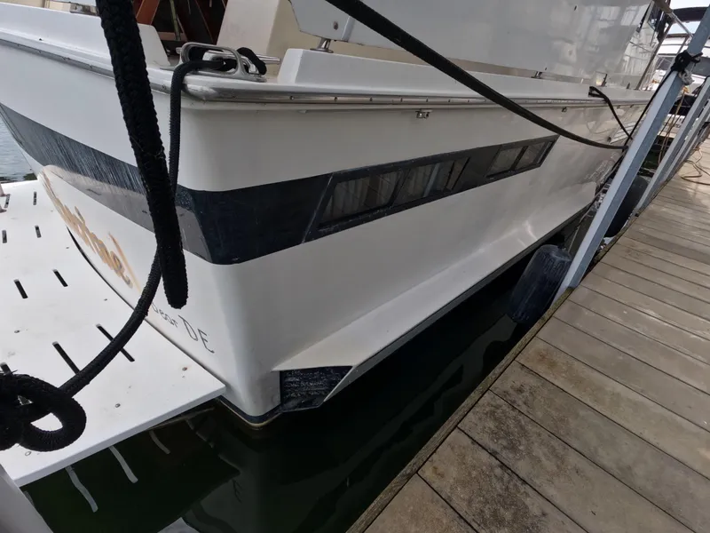 Slide: The Image of 1988 Viking Gulfstar 55 MY yacht docked at marina, side view. - 21