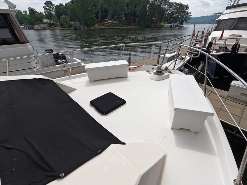 Slide: The Image of 1988 Viking Gulfstar 55 MY yacht deck with scenic lake view. - 26