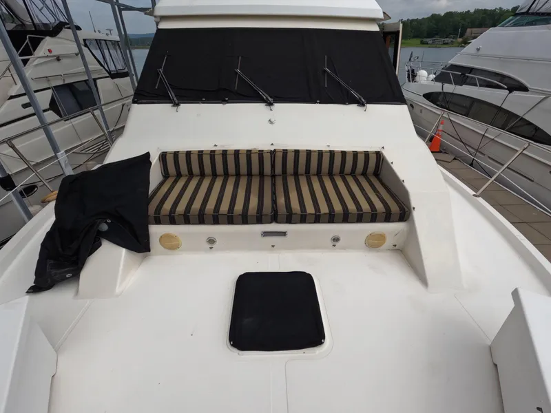 Slide: The Image of 1988 Viking Gulfstar 55 MY yacht with striped seating on deck. - 29