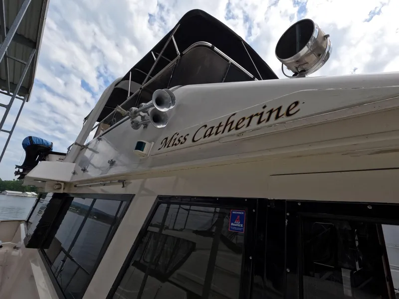 Slide: The Image of 1988 Viking Gulfstar 55 MY yacht "Miss Catherine" docked under cloudy sky. - 32