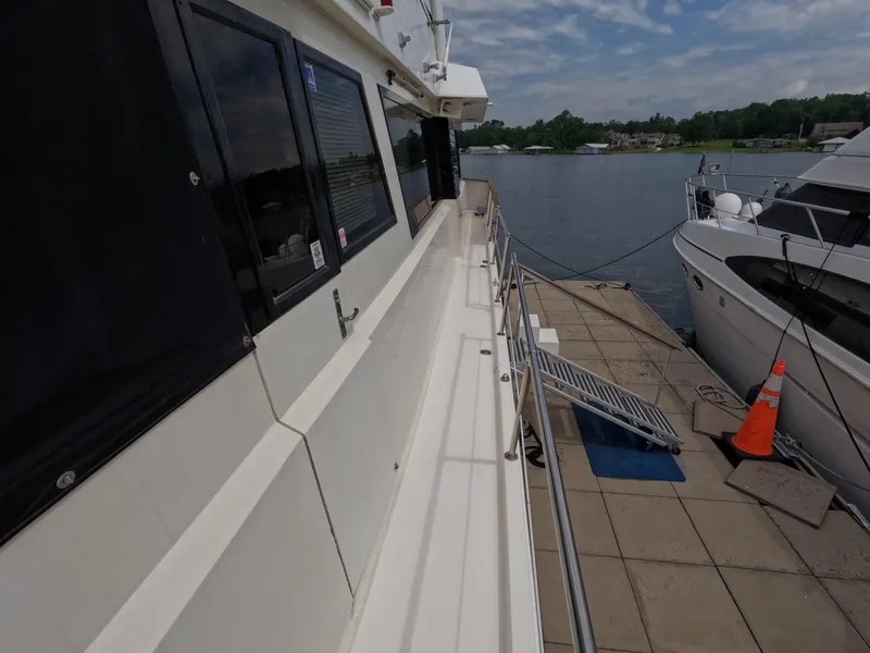 Slide: The Image of 1988 Viking Gulfstar 55 MY yacht docked at marina with clear skies. - 39