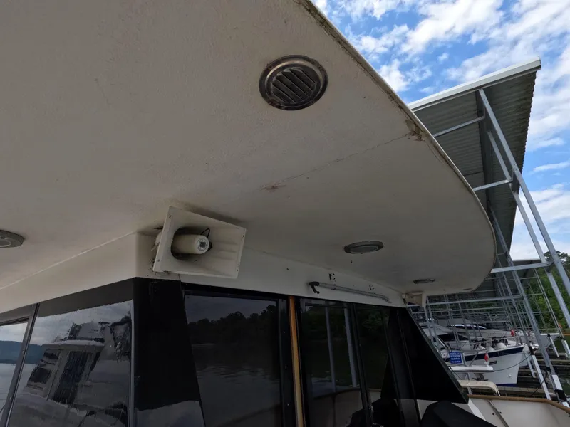 Slide: The Image of 1988 Viking Gulfstar 55 MY yacht exterior with docked boats and blue sky background. - 43