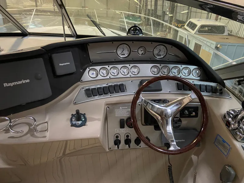 Slide: The Image of 2006 Four Winns 378 Vista boat dashboard with steering wheel and gauges. - 3