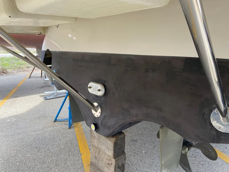 Slide: The Image of 2006 Four Winns 378 Vista boat hull with metal supports on a trailer. - 7