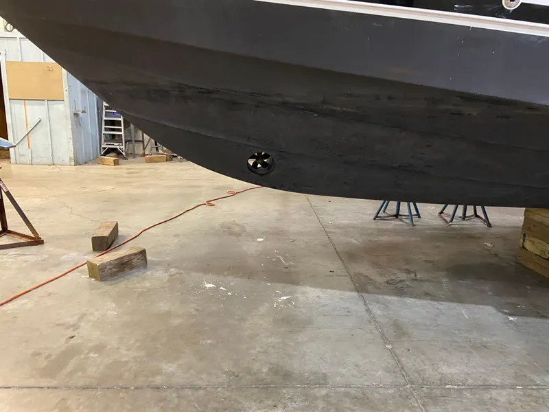 Slide: The Image of 2006 Four Winns 378 Vista boat hull in a workshop setting. - 9