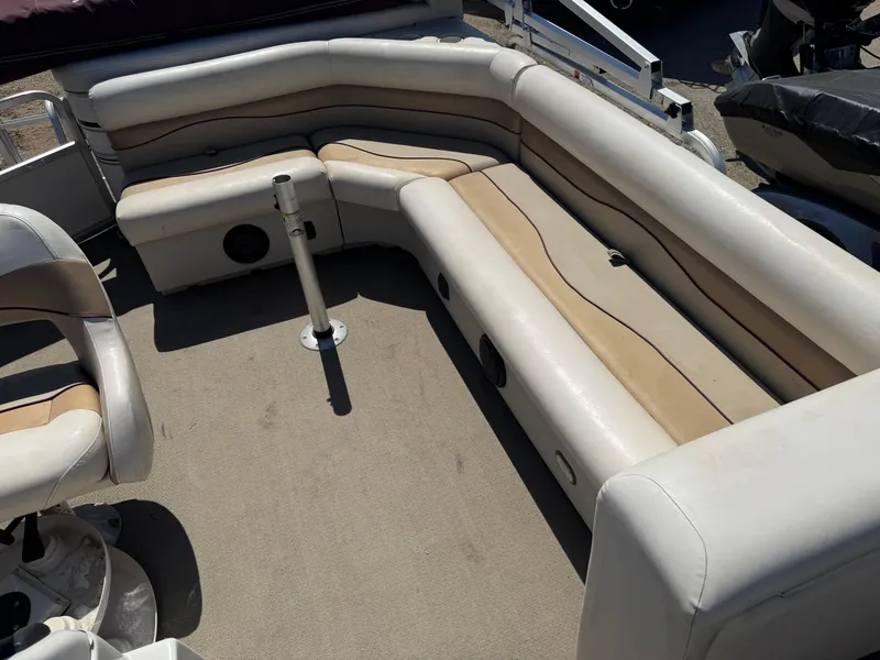 Slide: The Image of 2008 G3 SunCatcher 228 F&C Vinyl boat interior with beige seating. - 10