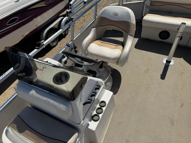 Slide: The Image of 2008 G3 SunCatcher 228 F&C Vinyl boat interior with steering console and seating. - 11
