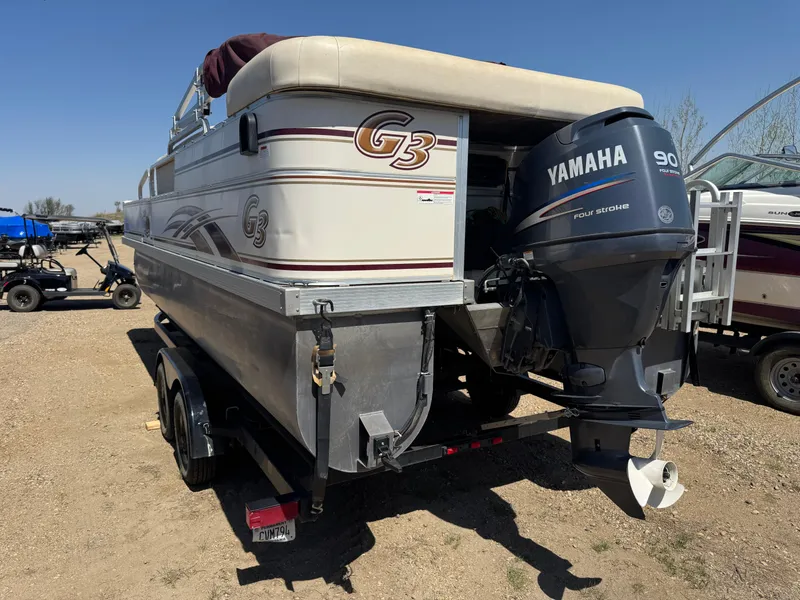 Slide: The Image of 2008 G3 SunCatcher 228 F&C Vinyl boat with Yamaha 90 outboard motor on trailer. - 4