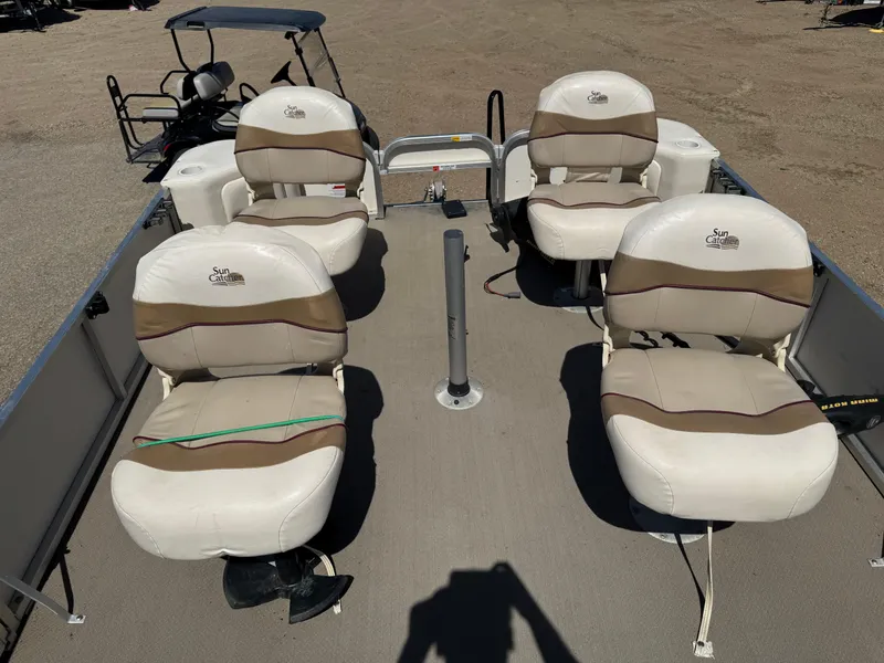 Slide: The Image of 2008 G3 SunCatcher 228 F&C Vinyl boat with four beige seats on deck. - 6