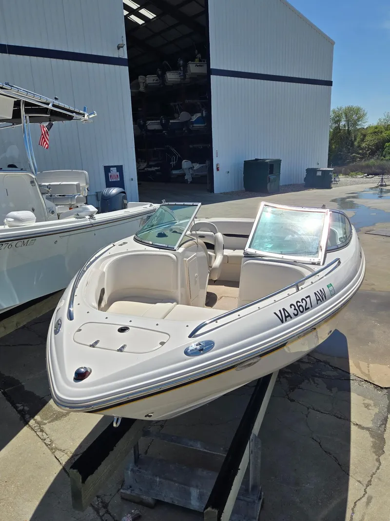 Slide: The Image of 2000 Chaparral 196 SSi boat on display outside a storage facility. - 2