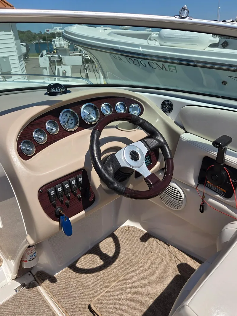 Slide: The Image of Dashboard of a 2000 Chaparral 196 SSi boat with steering wheel and gauges. - 5