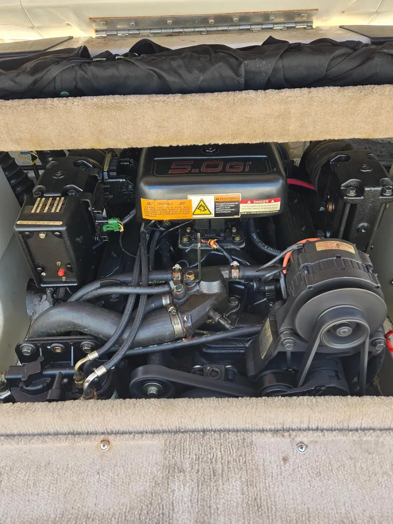 Slide: The Image of Engine compartment of a 2000 Chaparral 196 SSi boat, featuring a 5.0 Gi engine. - 6