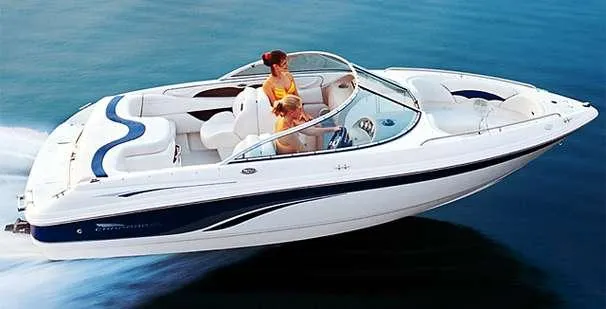 Slide: The Image of 2000 Chaparral 196 SSi speedboat cruising on water with passengers enjoying the ride. - 9