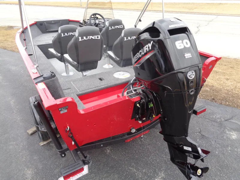 Slide: The Image of 2025 Lund 1650 Rebel XL SS boat with Mercury 60 outboard motor, red exterior. - 10
