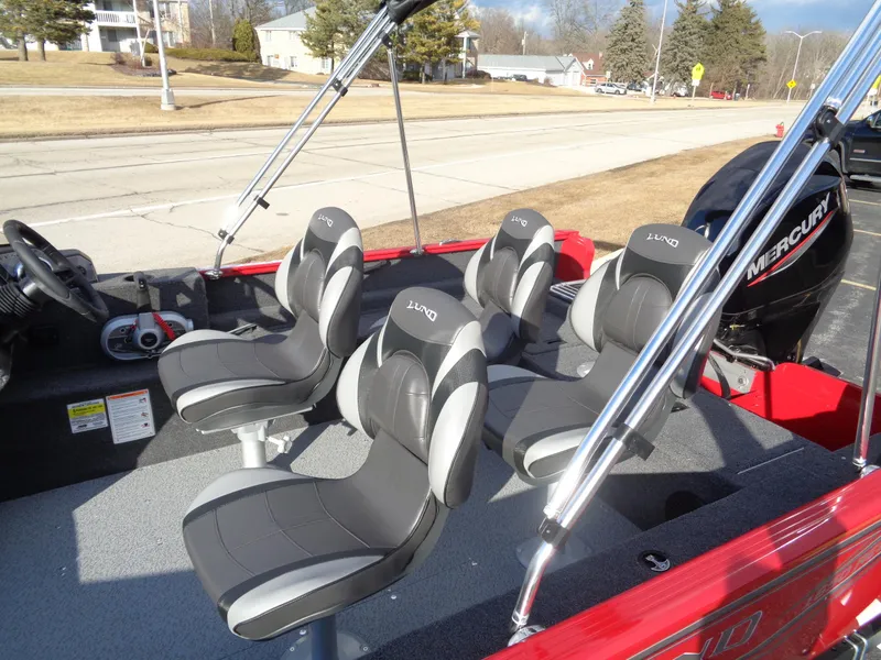 Slide: The Image of 2025 Lund 1650 Rebel XL SS boat with four seats and Mercury engine. - 18