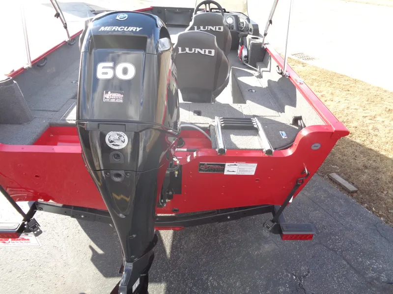 Slide: The Image of 2025 Lund 1650 Rebel XL SS boat with Mercury 60 outboard motor, red exterior. - 20