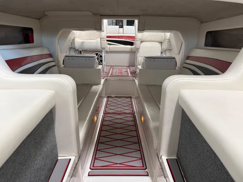 Slide: The Image of Interior of a 2006 Sleekcraft Heritage boat with white and red seating. - 12
