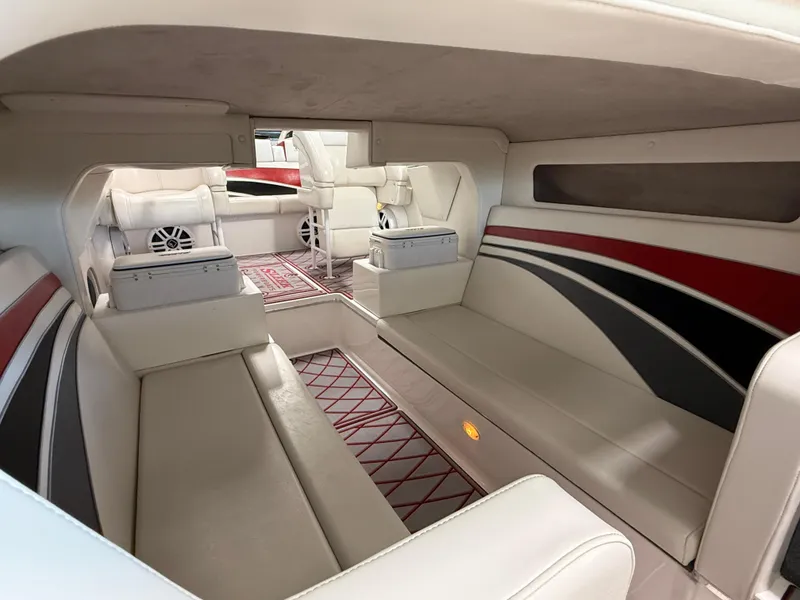 Slide: The Image of 2006 Sleekcraft Heritage boat interior with white seating and red-black accents. - 14