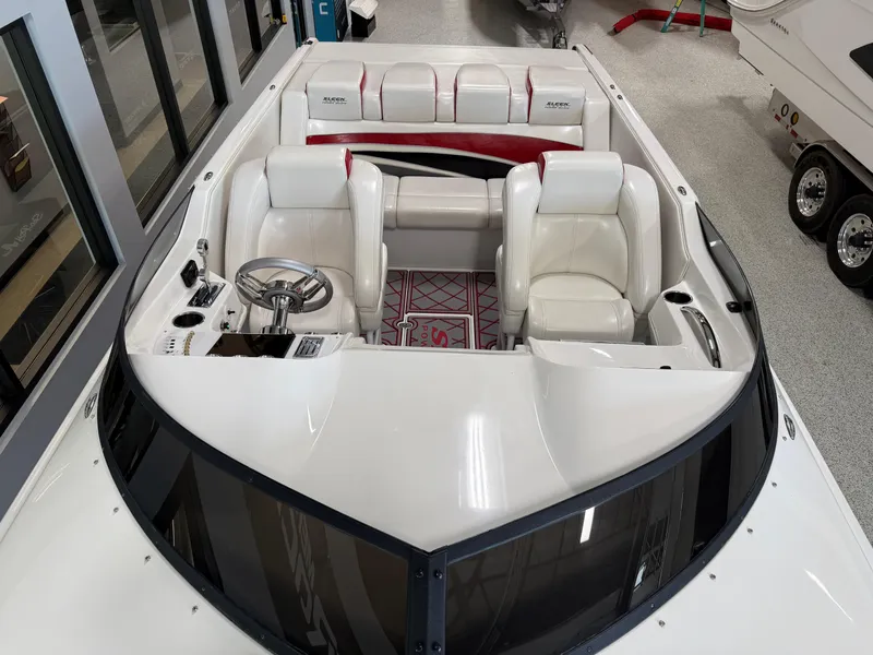 Slide: The Image of 2006 Sleekcraft Heritage boat interior with white leather seats and modern steering wheel. - 15