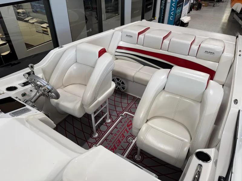 Slide: The Image of 2006 Sleekcraft Heritage boat interior with white and red seating, modern design. - 17