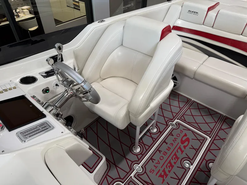 Slide: The Image of Luxurious 2006 Sleekcraft Heritage boat interior with white leather seating and modern dashboard. - 18
