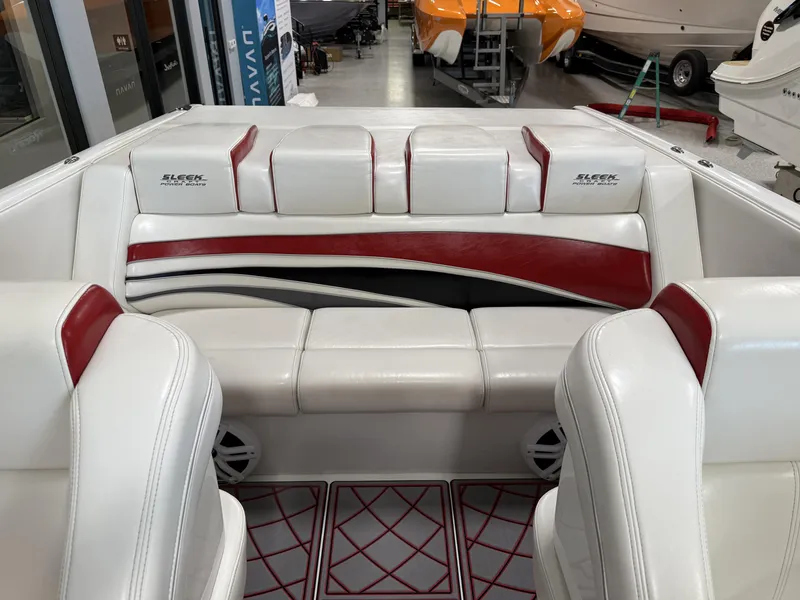 Slide: The Image of 2006 Sleekcraft Heritage boat interior with white and red seating. - 19