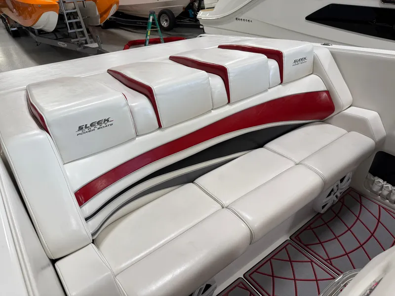 Slide: The Image of 2006 Sleekcraft Heritage boat interior with white and red seating. - 20