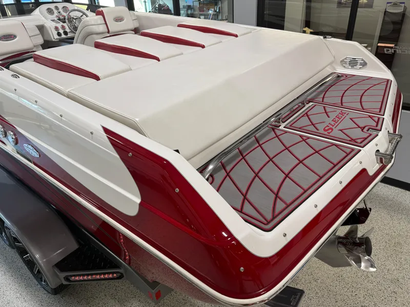 Slide: The Image of 2006 Sleekcraft Heritage boat with red and white upholstery, sleek design, and modern dashboard. - 27