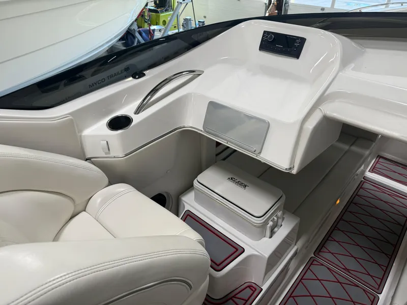 Slide: The Image of 2006 Sleekcraft Heritage boat interior with white seating and modern dashboard design. - 36
