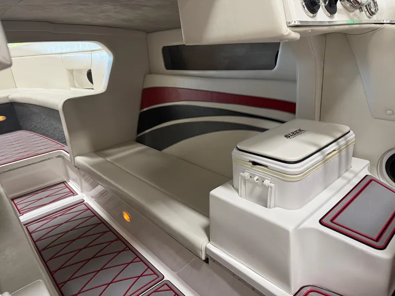 Slide: The Image of 2006 Sleekcraft Heritage boat interior with modern seating and stylish red accents. - 41