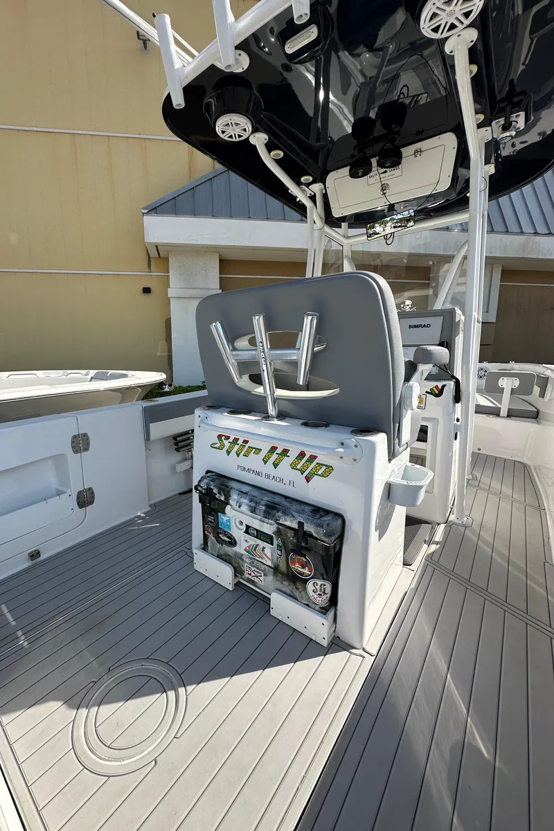 Slide: The Image of 2021 Release 240 RX boat interior with seating and fishing equipment. - 13