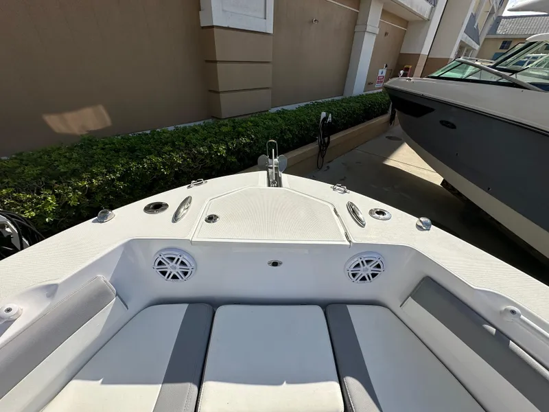 Slide: The Image of Bow view of 2021 Release 240 RX boat, featuring seating and speakers. - 31