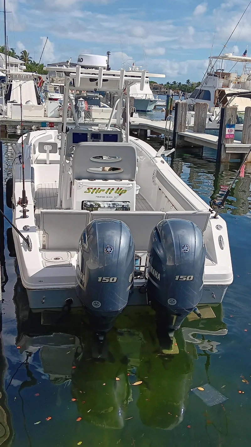 Slide: The Image of 2021 Release 240 RX boat docked with twin 150 horsepower engines. - 42