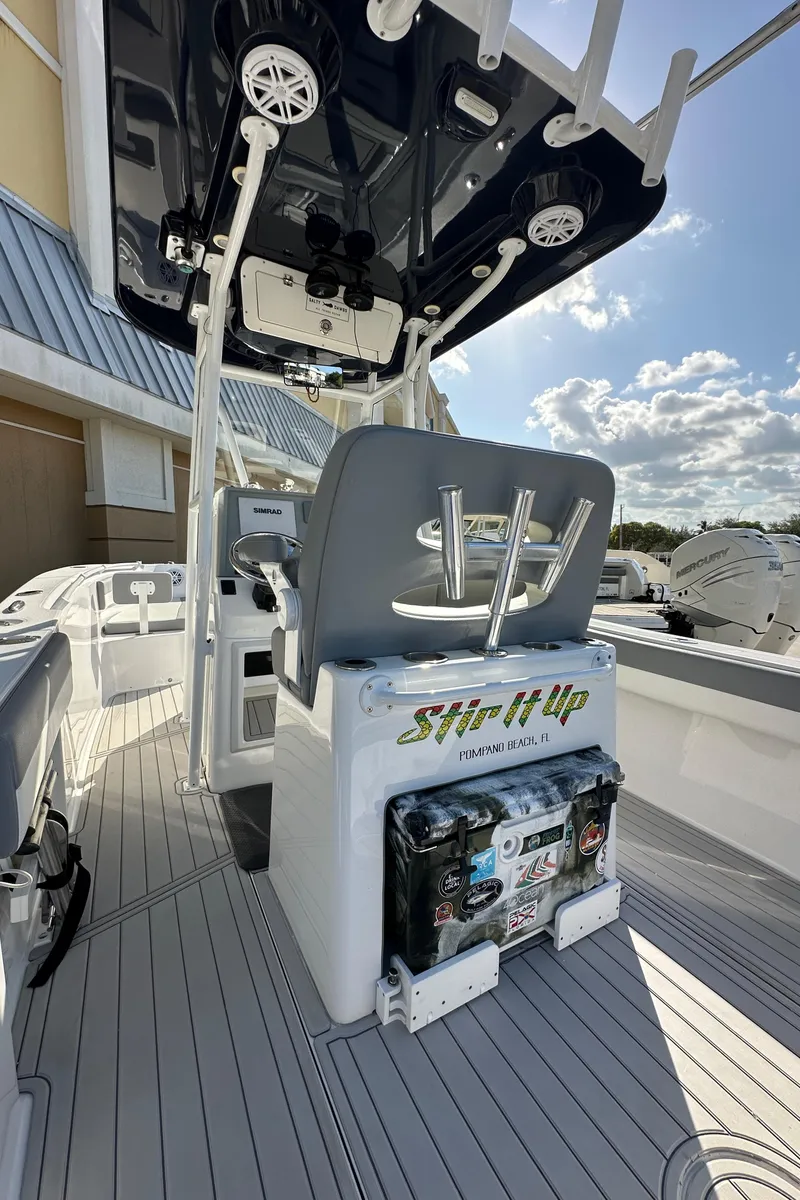 Slide: The Image of 2021 Release 240 RX boat interior with seating and equipment under a clear sky. - 8