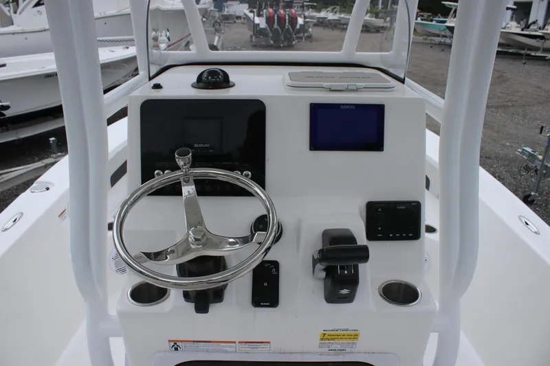 Slide: The Image of 2025 Sea Pro 202 CC boat console with steering wheel and navigation controls. - 11