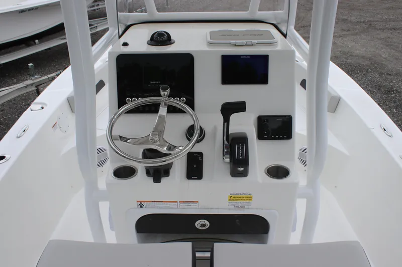 Slide: The Image of 2025 Sea Pro 202 CC boat console with steering wheel and controls. - 13