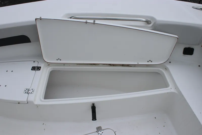 Slide: The Image of Open storage compartment on a 2025 Sea Pro 202 CC boat. - 14