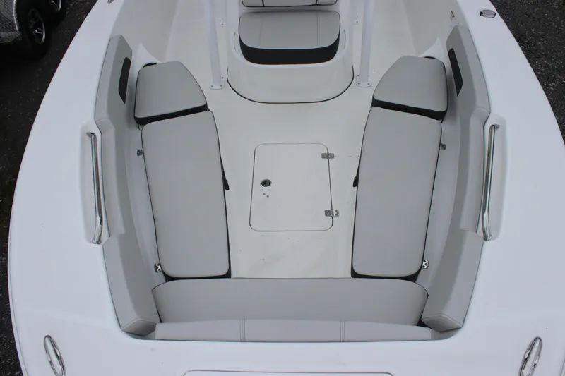 Slide: The Image of 2025 Sea Pro 202 CC boat interior with cushioned seating and storage hatch. - 17