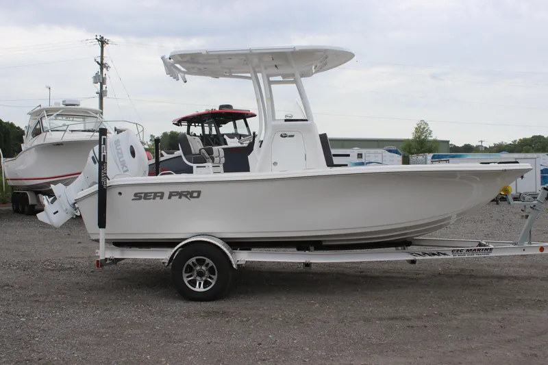Slide: The Image of 2025 Sea Pro 202 CC boat on trailer, parked outdoors. - 2