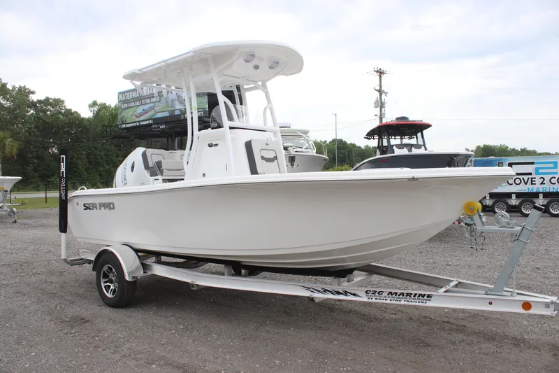 Slide: The Image of 2025 Sea Pro 202 CC boat on trailer, displayed outdoors. - 5