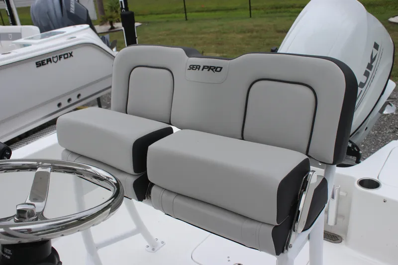 Slide: The Image of 2025 Sea Pro 202 CC boat seating with steering wheel, featuring modern design and comfort. - 9