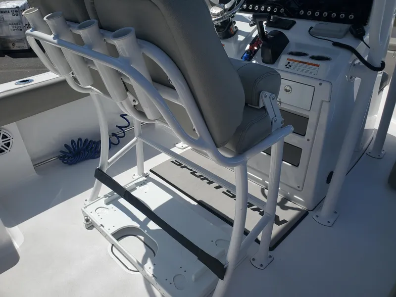 Slide: The Image of 2022 Sportsman Open 212 Center Console boat interior with seating and rod holders. - 12