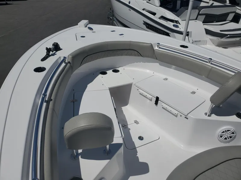 Slide: The Image of 2022 Sportsman Open 212 Center Console boat interior with seating and storage compartments. - 2