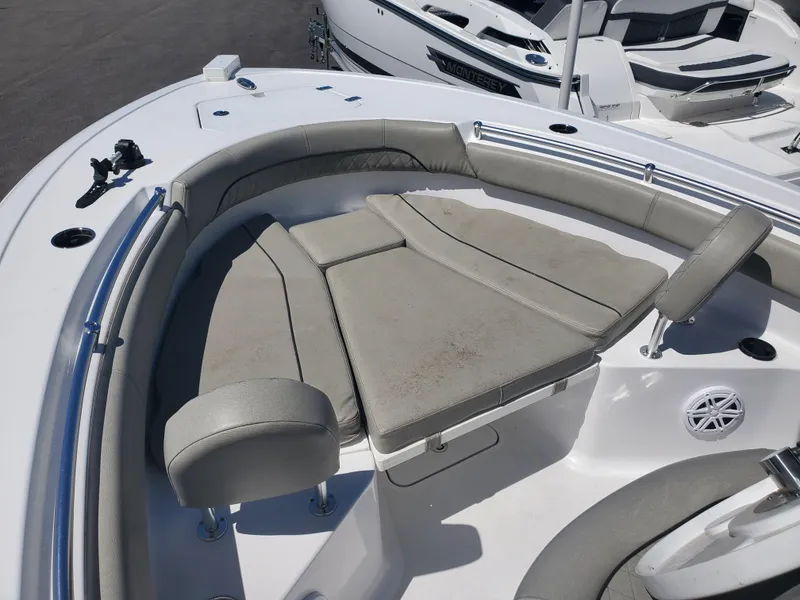Slide: The Image of 2022 Sportsman Open 212 Center Console boat with cushioned seating area. - 4