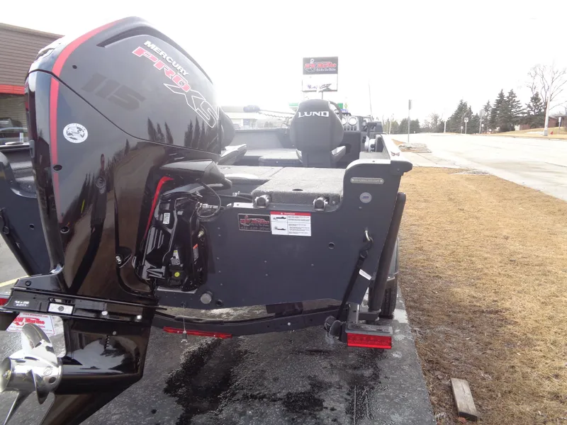 Slide: The Image of 2025 Lund 1775 Adventure SS boat with Mercury Pro XS engine, parked on roadside. - 10
