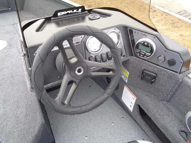 Slide: The Image of Steering console of 2025 Lund 1775 Adventure SS boat with modern controls and gauges. - 22