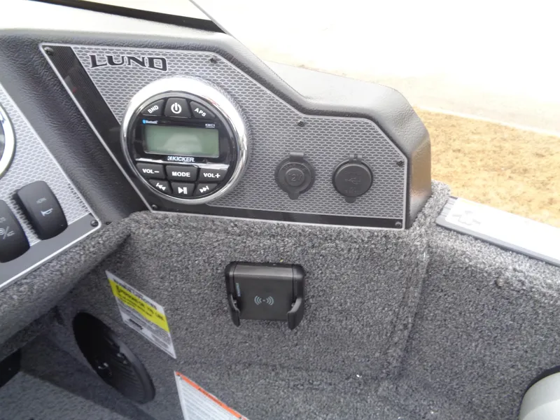 Slide: The Image of Control panel of 2025 Lund 1775 Adventure SS boat with audio system and controls. - 24