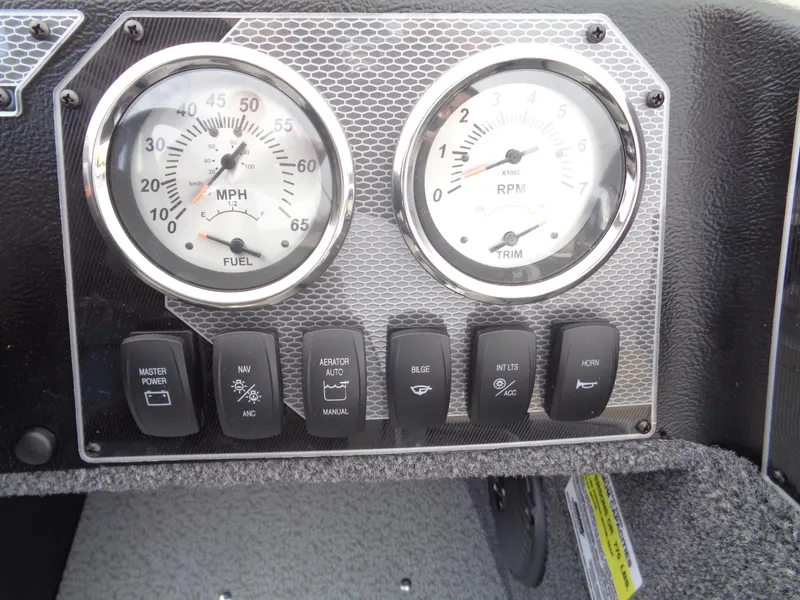 Slide: The Image of Dashboard of 2025 Lund 1775 Adventure SS with speedometer, tachometer, and control switches. - 25